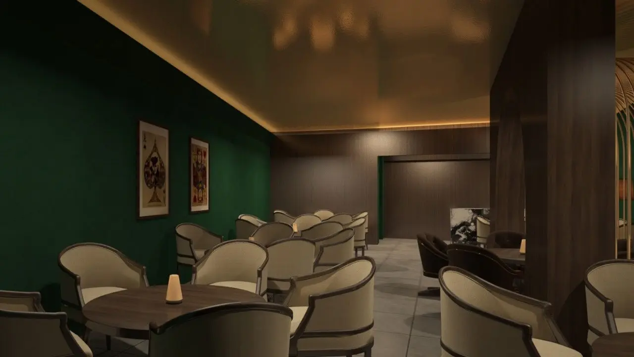 Moody Chandigarh Club lounge with curved cream armchairs, green walls and warm lighting
